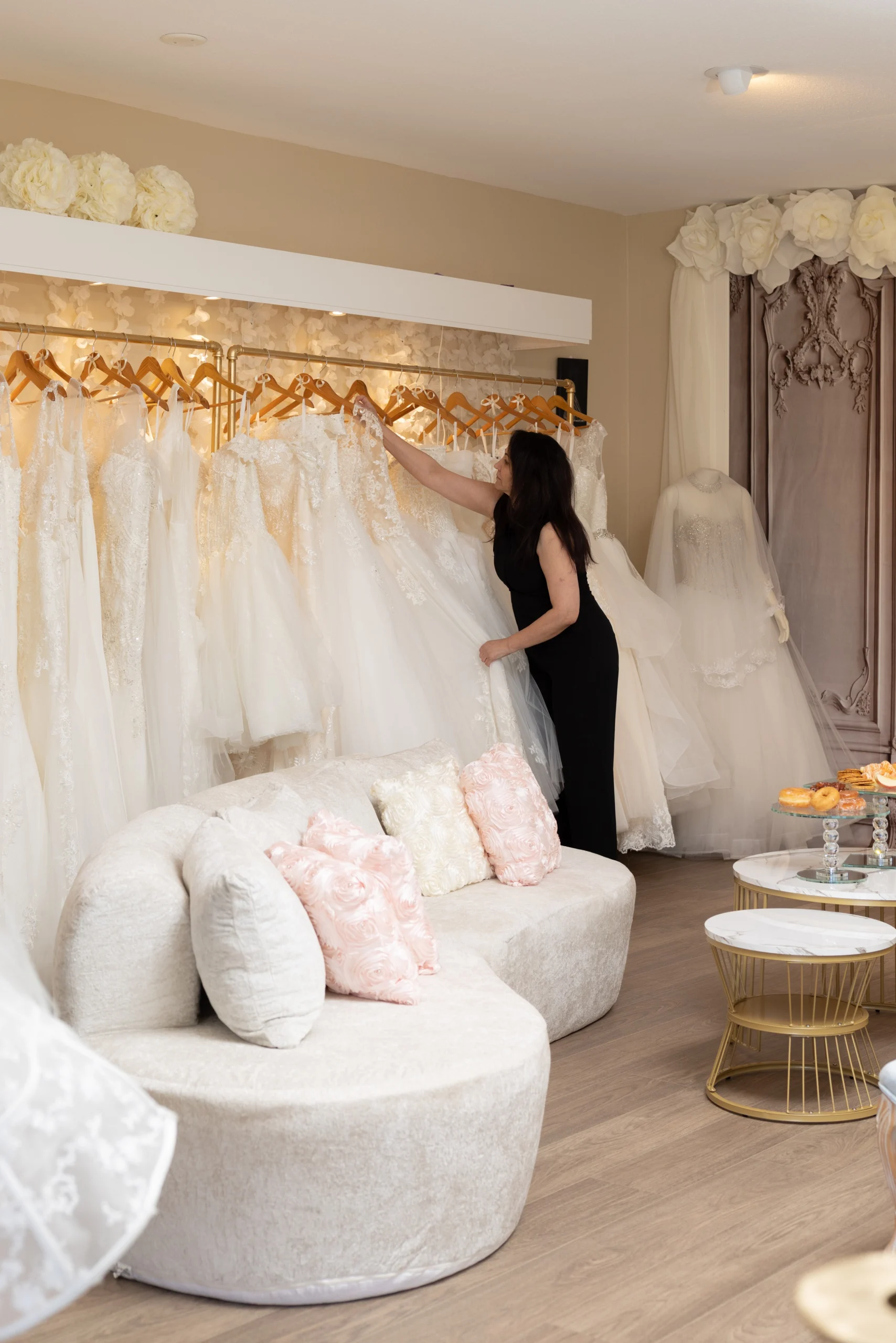 Michelle Arranging Gowns Michelle Diane, founder and lead designer of Diane Bridal